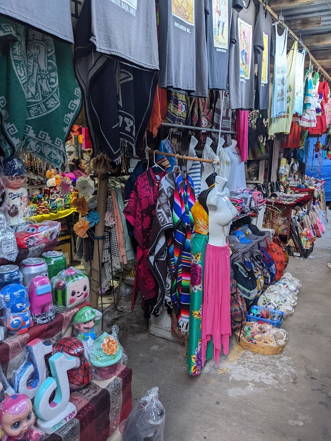 Rosarito, mexico flea market with mexican dresses, toys, blankets and t-shirts.