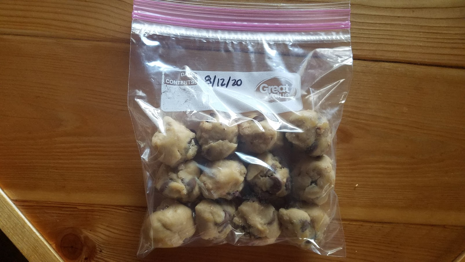 A ziploc bag with chocolate chip dough balls 
