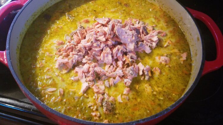 Salmon chowder with salmon on top of the soup